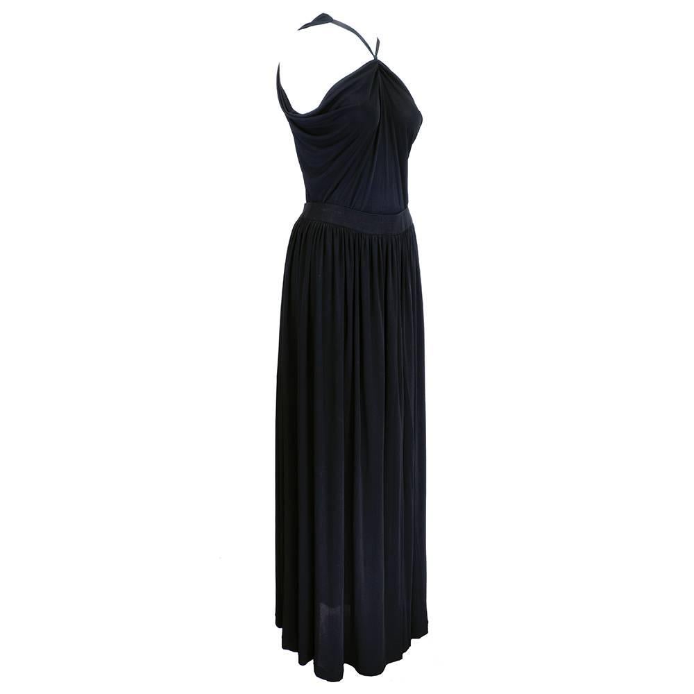 Classic 2 piece ensemble by famed Yves Saint Laurent for his Rive Gauche label. Flowy black jersey draped halter top with  full length skirt. Goes from California casual to NYC black tie. Beyond sexy in YSL's inimitable style. 
Skirt - 44