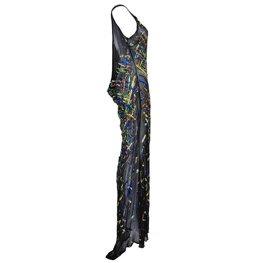 Dramatic unlabeled 1980's gown - bias cut with deeply draped back and short train. Multiple colored sequins.  Sheer with satin trim. Incredible silhouette.