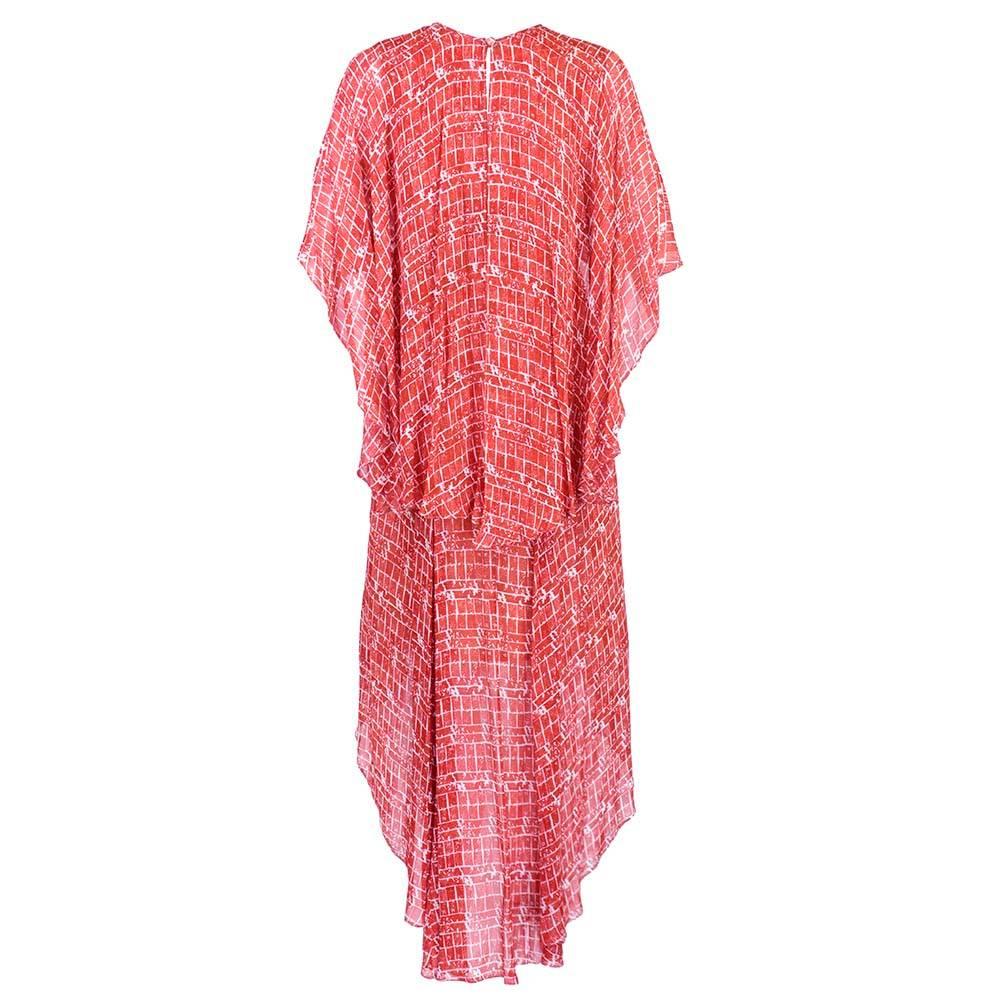 Brick print Jean Varon dress short in front long in back. Tiered and flouncy rayon chiffon. Empire waist and fully lined.