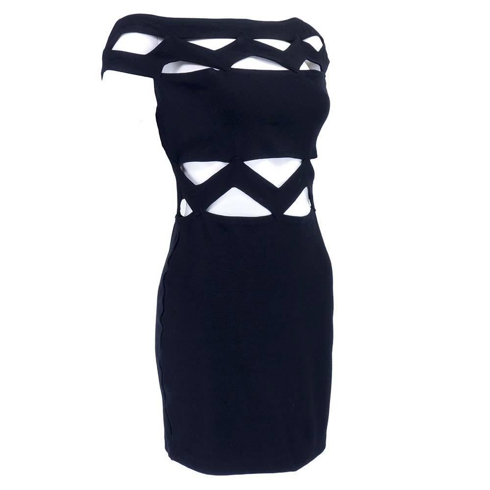 Ultra sexy body con mini dress by the master of the genre Thierry Mugler. Strategic zig zag cut outs in bodice with body hugging short skirt.  Side zip although sizing is flexible due to stretch in fabric.