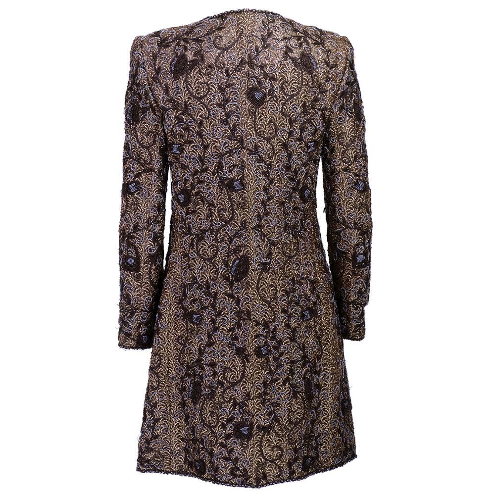 Heavily beaded and embroidered chocolate brown evening coat by the great Oscar de la Renta circa late 1980s.  Vine motif pattern with zip front under button closure. Fully lined.