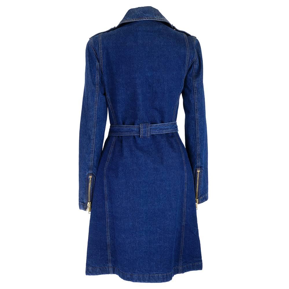 Early 21st century denim trench coat labelled D&G by Dolce and Gabbana. Heavyweight dark denim with quilted lining and matching belt. New with tags and brass metal hardware. Biker chic.