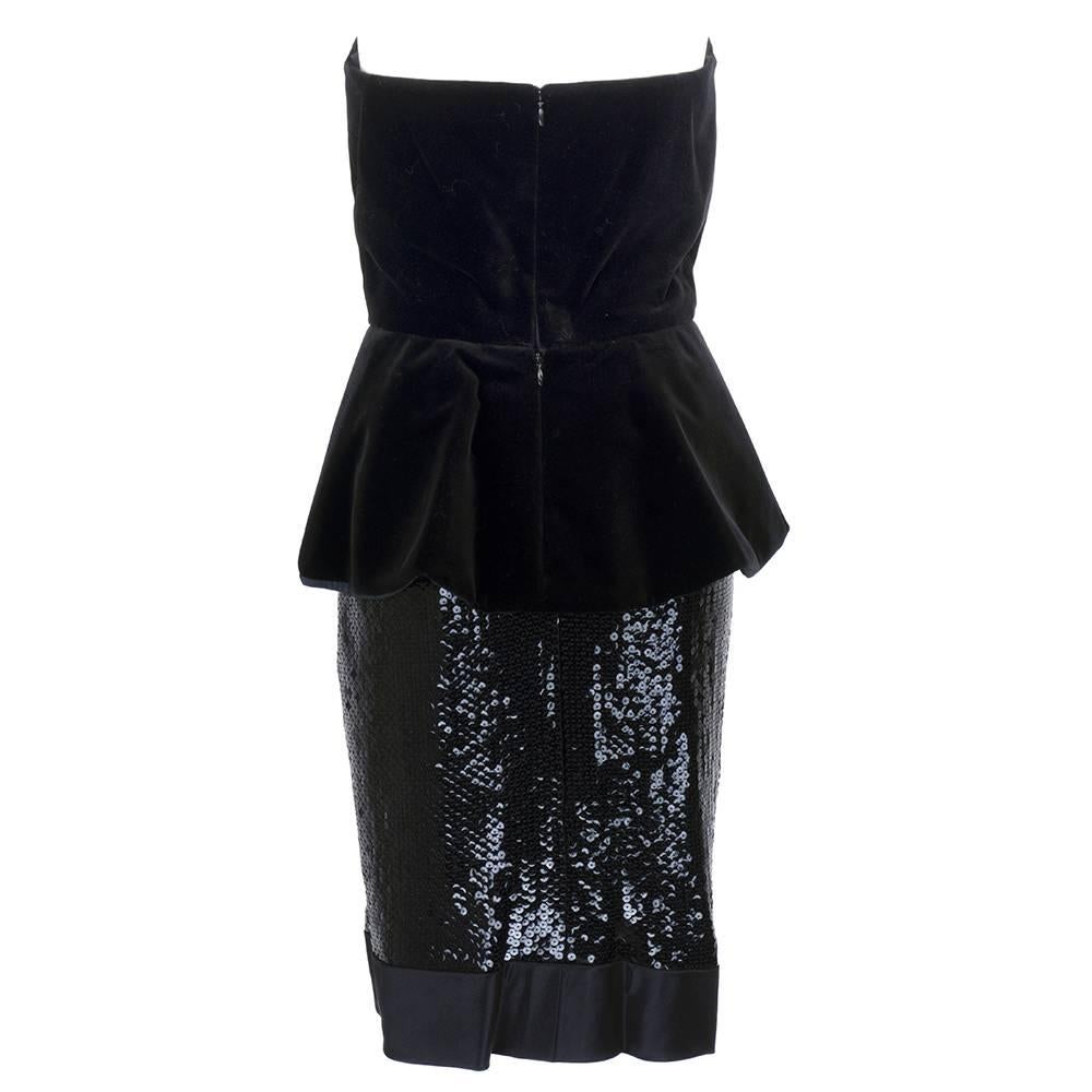 Classic by the master Bill Blass. Black strapless cocktail dress in velvet, satin and sequins. Peplumed top with boned bodice and straight sequined skirt trimmed in satin. Sweet bow detail down bodice front. Zips up back and fully lined. Perfect