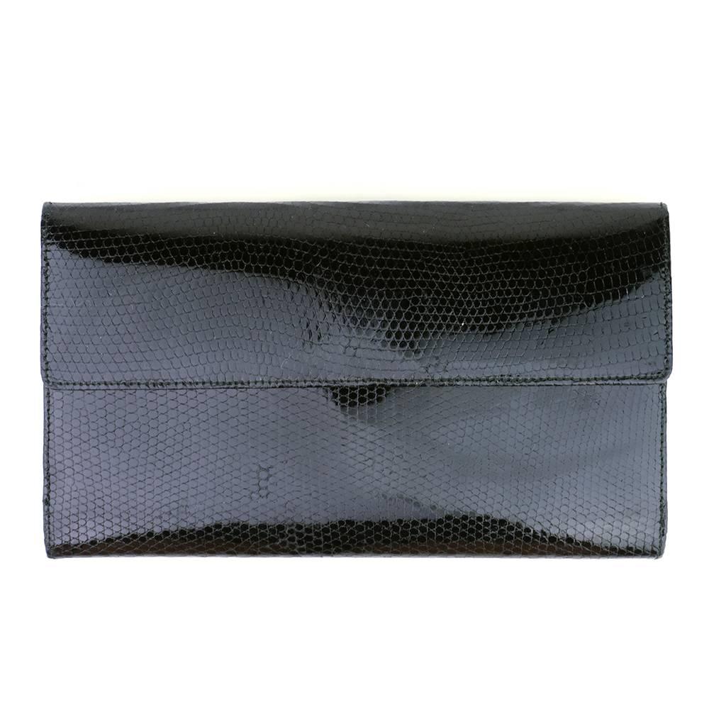 Slim dressy wallet by accessories queen Judith Lieber. Gathered flap on one side with mini frog accents. Can be worn dressy or casual.