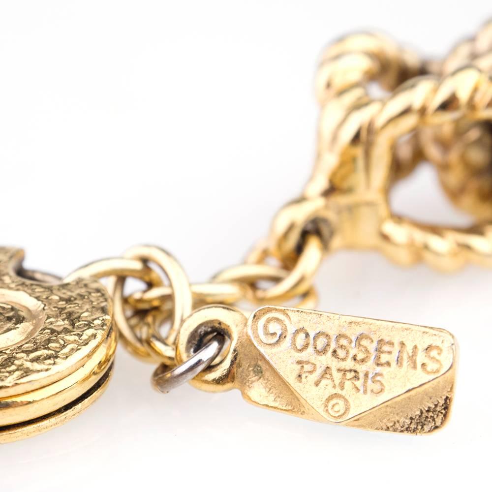 Outstanding statement collar by the house of couture jewels Goossens. Alternating links of dore bronze and wood rings. Heavyweight construction and oversized clasp with logo.