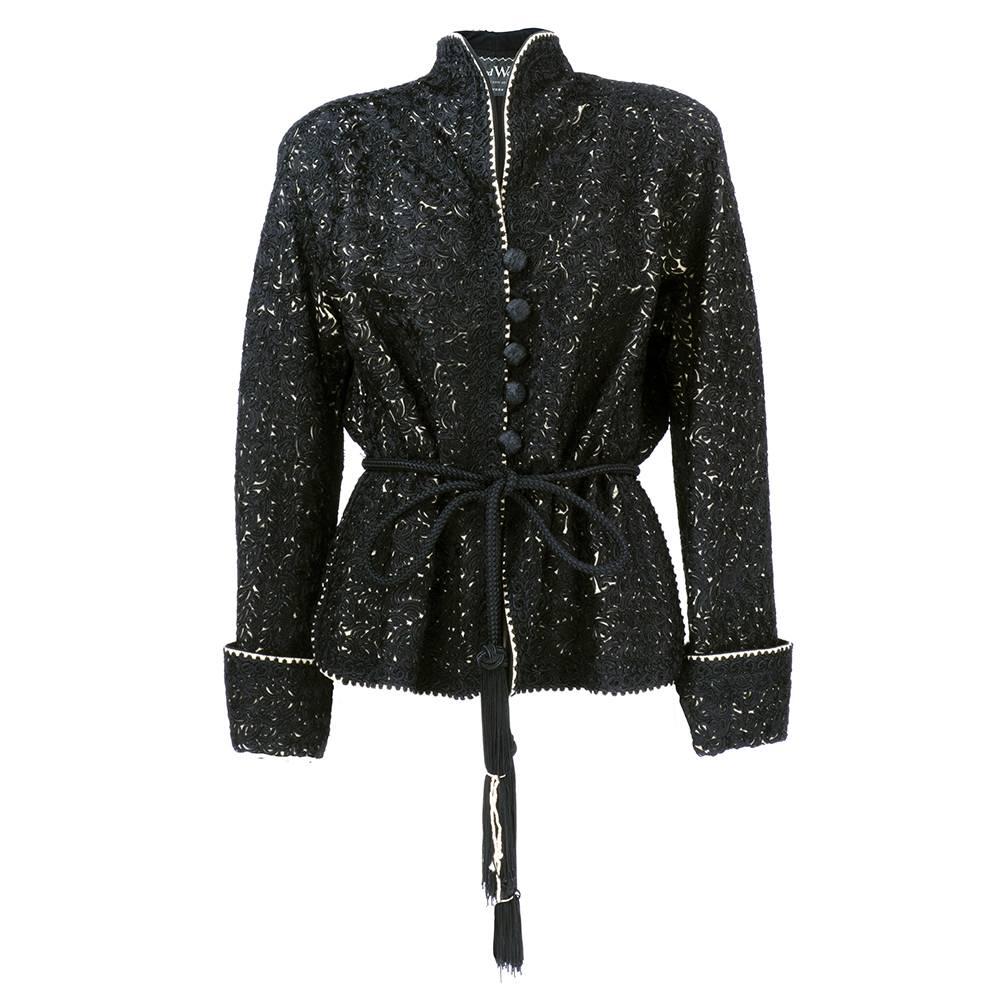 Stunning heavyweight jacket of black wool completely covered in soutache with white wool crepe trim. Stand up collar with woven buttons and matching corded semi-attached belt with fringe. fully lined with side pockets. Incredibly dramatic - a