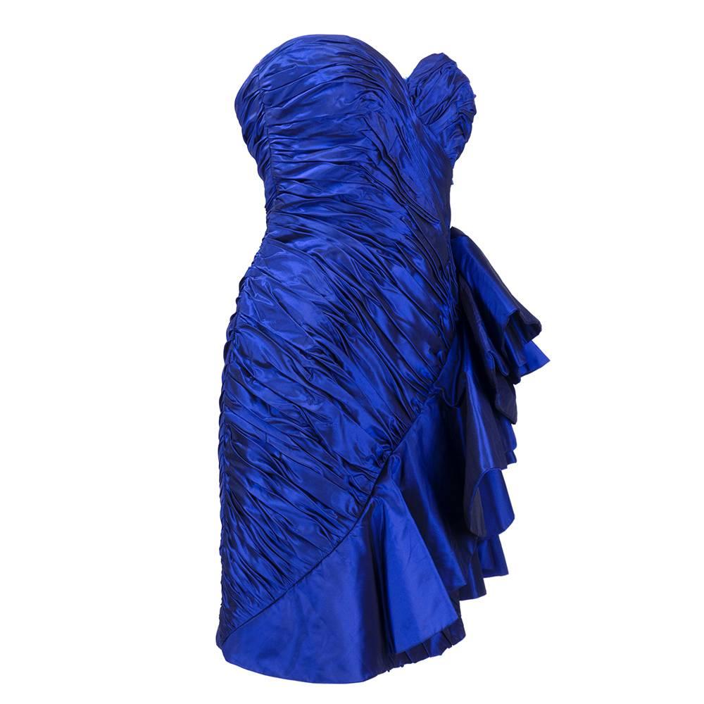 Iridescent blue strapless cocktail dress by Vicky Tiel Couture circa 1980s. Micro mini with shirred bodice and asymmetrical swag.Fully lined. Perfect New Years Eve dress!