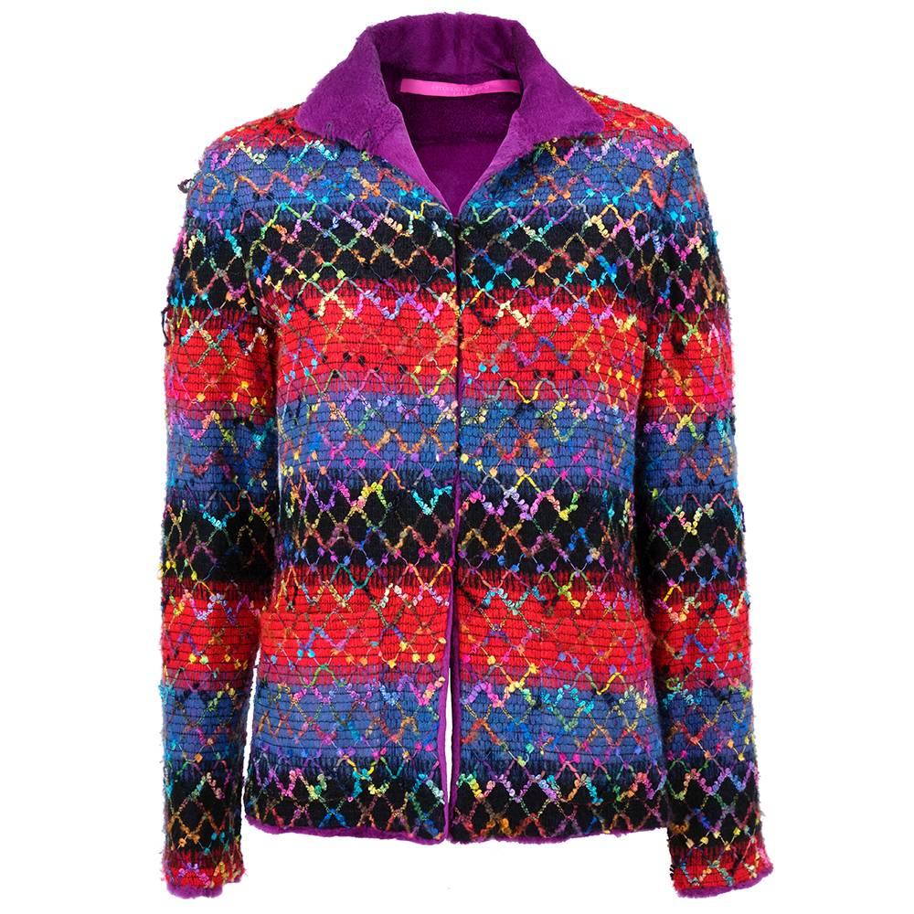 Vibrant, textured jacket in rainbow hues lined in purple dyed shaved rabbit. Open front with hook and eye closure and patch pockets.  Wonderful ribbon-work woven into over-stitiching on loose weave wool. 