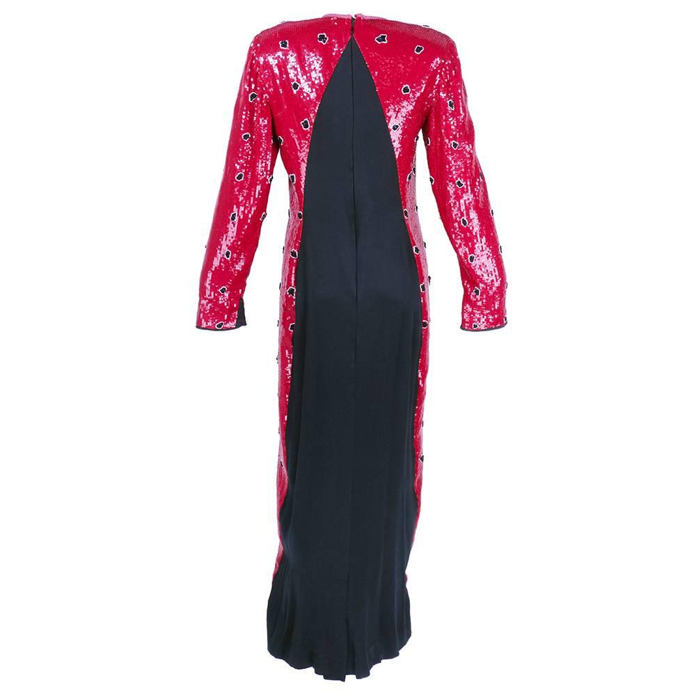 Gorgeous Geoffrey Beene solid sequined gown w/ spaced floral details circa 1980s.  The back has been left with black satin charmeuse in a graduating triangle.  Side slits to make walking easy! An american classic.