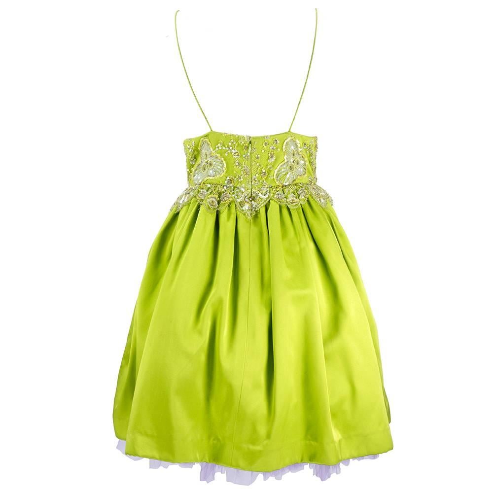 Adorable baby doll style cocktail dress in luxurious chartreuse charmeuse silk. Bodice overlaid with lace embellished with beads and sequins. Fully lined with multi-layered lavender crinoline. Fabulous in person!