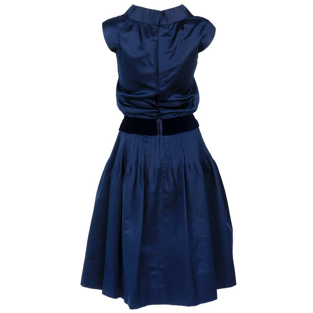 Early 1960s Christian Dior-New York Blue Peau de Soie Dress with velvet band at waist and inserted in bodice. Lined in organza with detached foundation present. Small tears in interior boned bodice.