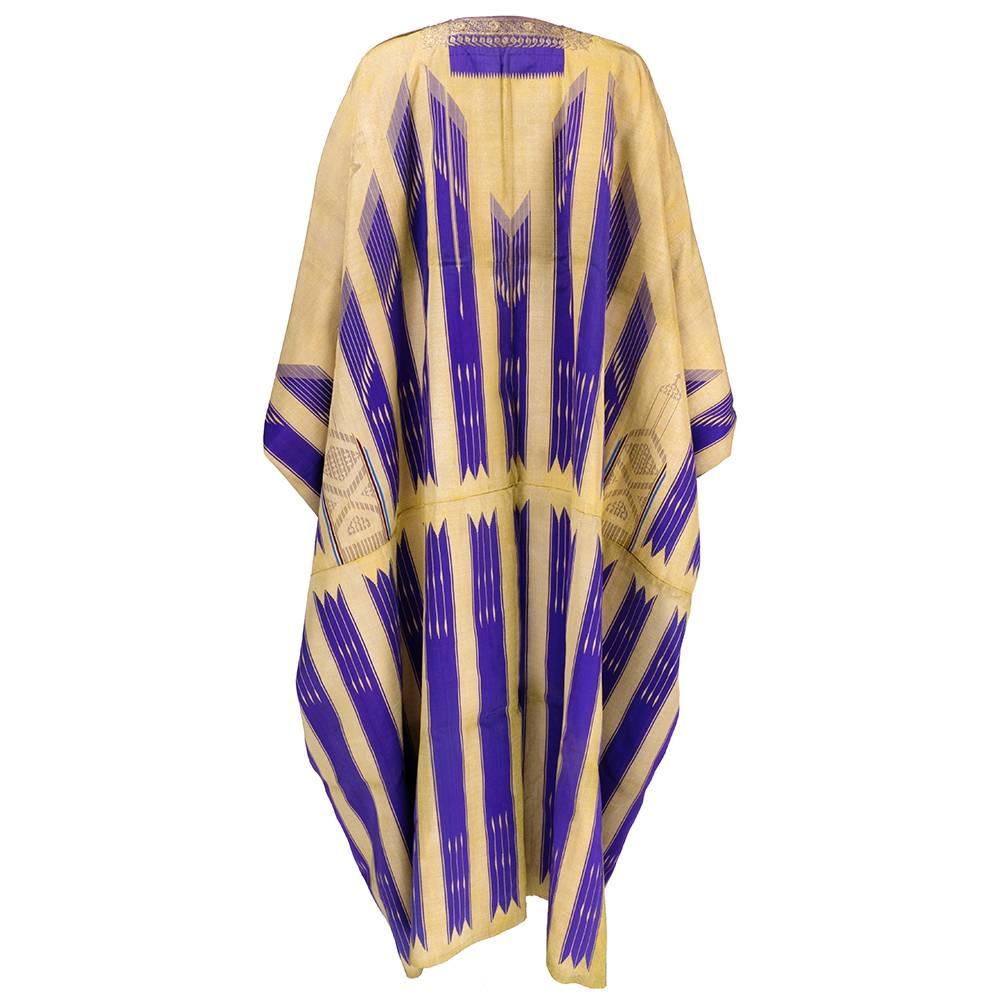 Gorgeous early 20th century open caftan tapestry woven in gold metallic with purple striping from Syria. Edged and embellished with bullion couched embroidery.  A similar example is in the collection of the Metropolitan Museum in New York.