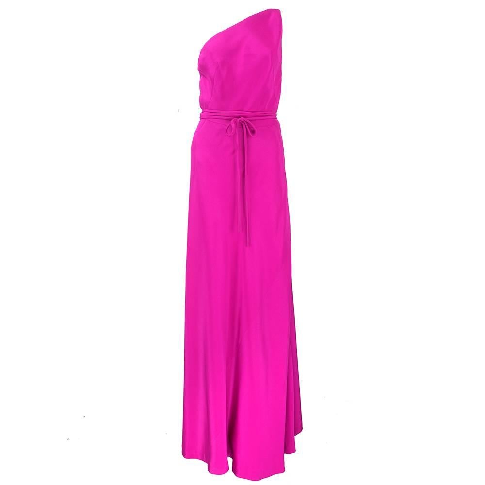 Gorgeous Gown by the iconic Madame Gres. Brilliant Magenta silk gown with wraparound ties. Matching asymmetrical shawl.  Great statement piece and very collectable.
