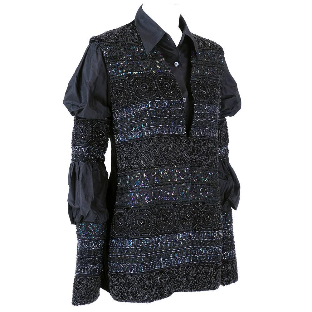 Heavily embellished100% silk blouse with silk blend velvet vest by Italian Fashion House Callaghan.  Incredible, heavy beadwork on arms and front of vest. Vest is fully lined and vented at hem. Can be worn together or separately.

Vest-
Bust: