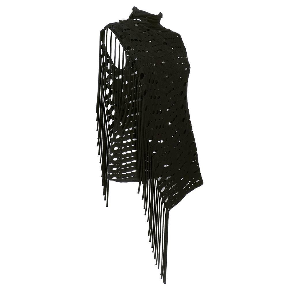 Very cool black perforated Kenzo sweater and scarf ensemble. Sleeveless, double layered with fringe. Buttons up neck and comes with long, matching scarf. 100% wool.