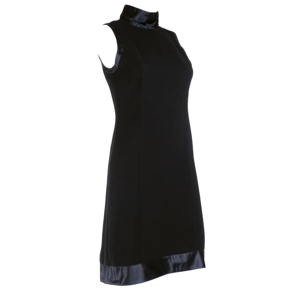 Great reinterpretation of a Courreges classic. 60s space age style cut updated in the 90s. Sleeveless, high neck, fully lined and trimmed in satin. Perfect little black dress. 
