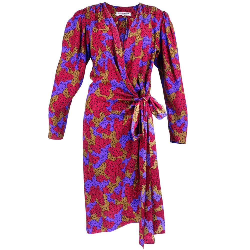 Another classic concept piece by Yves Saint Laurent.  A simple little wrap dress in a vibrant tri-color abstract print. Ruched at ties with inner hook and eye. Sizing flexible.