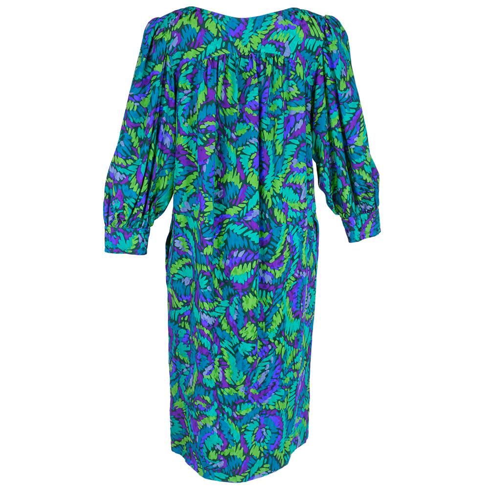 Classic YSL silhouette from the 1980s.  Silk jacquard in greens and blues in an abstract print. Quarter sleeves and hidden slash pockets. Great with or without a belt.