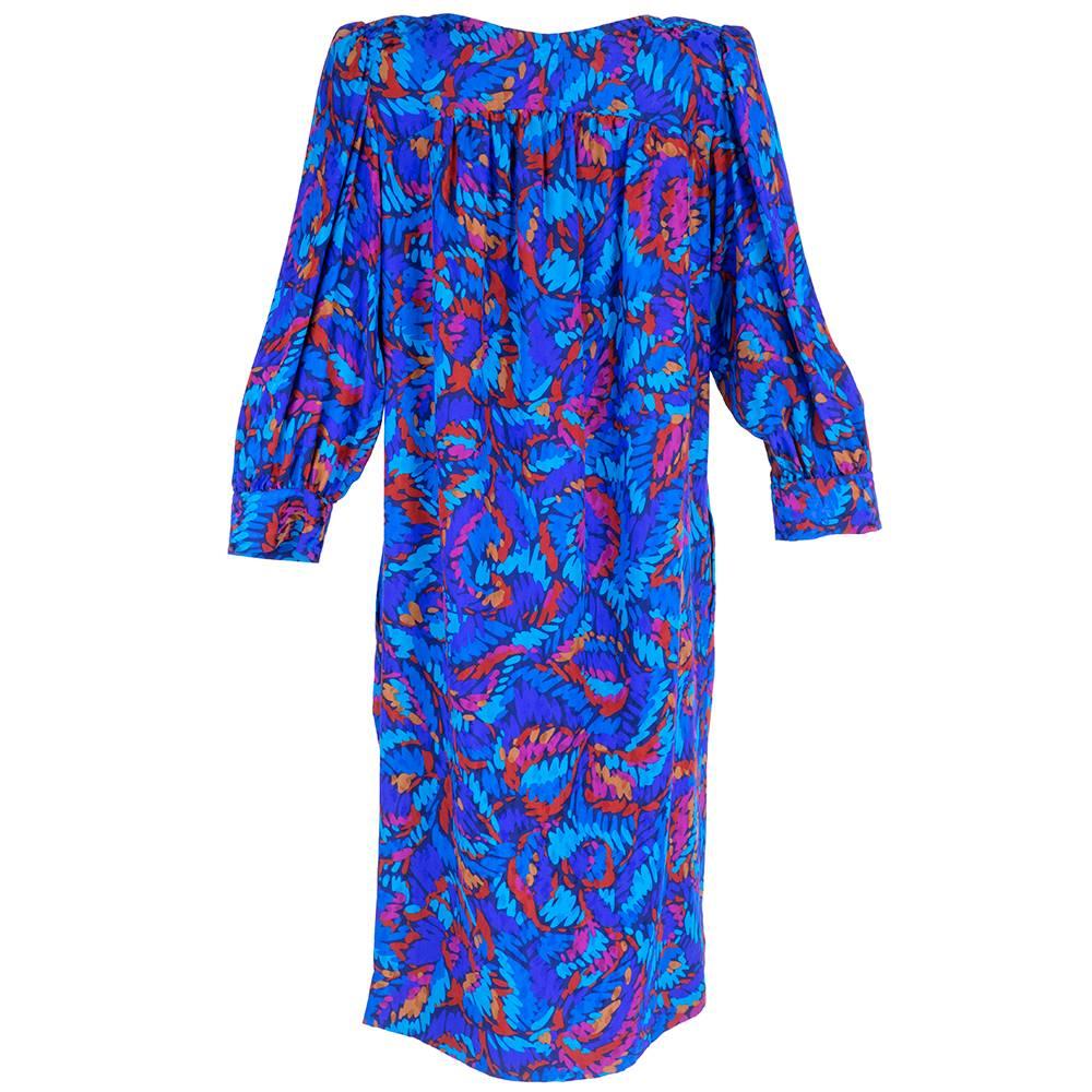Iconic YSL silk shift with abstract floral. Hidden, slash pockets. Slightly padded shoulders.