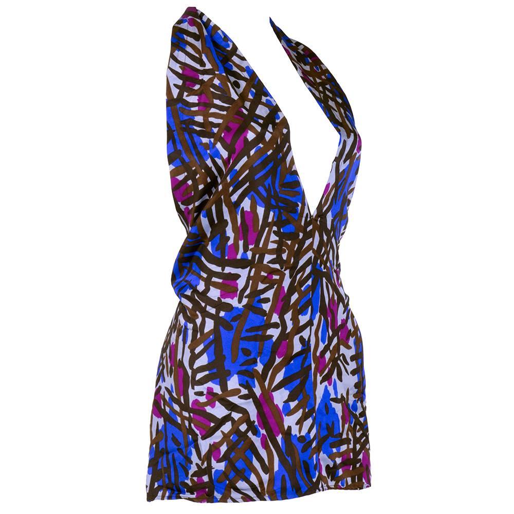 Sexy silk halter by YSL from the 1970s. Abstract print with tie neck. Pullover style.