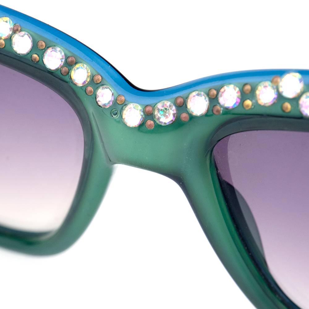 The most iconic eyewear brand from the 80s in vibrant green. Edged around frame with iridescent rhinestones. 