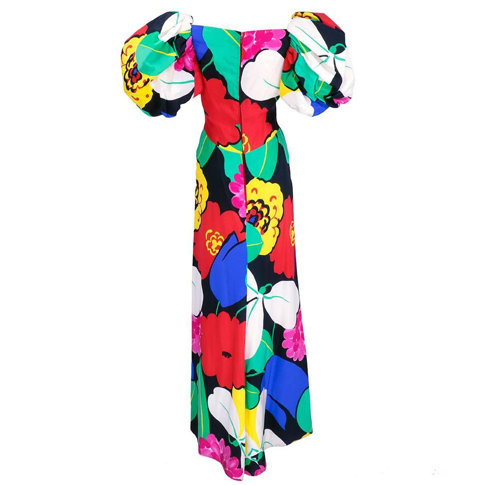Super vibrant op art oversized floral print gown with oversized puffed sleeves. Silk and fully lined. Wonderful statement piece. Some small step through tears near hem only on lining - not visible when worn. 