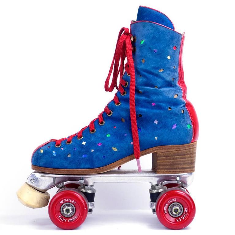 Spectacular roller skates circa 1970s. Blue suede with peek-a-boo metallic cutouts.Trimmed in red metallic leather. These absolutely have to be the very best skates ever.