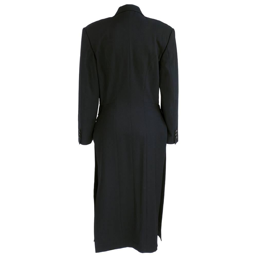 Classically styled overcoat in lightweight 100% wool gaberdine. Unlined and slit up sides to waist. 