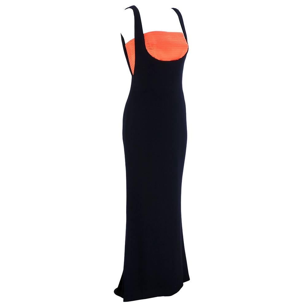 Dramatic 2 piece gown by Gianni Versace circa 1990s. Black lightweight wool/silk blend over dress - fully lined. With contrasting orange quilted 100% silk bandeau top - zips up side.

Top measures -
Bust: 32"
Length: 9.5"