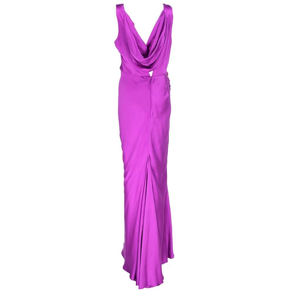 High glam bias cut gown 100% silk by J. Mendel in fuschia. Draped neckline  and wrapped gems at waistband. Swagged at waist and fully lined. A perennial piece - timeless classic.
