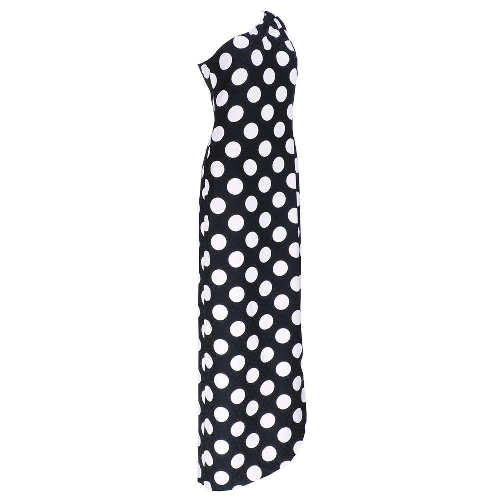 Best use of polka dots ever. One shoulder silk jacquard polka dots on polka dots by 80s mainstay Adolfo. Full slit that petals at hem. Fully lined and comes with white with black dots coordinating wrap. 

