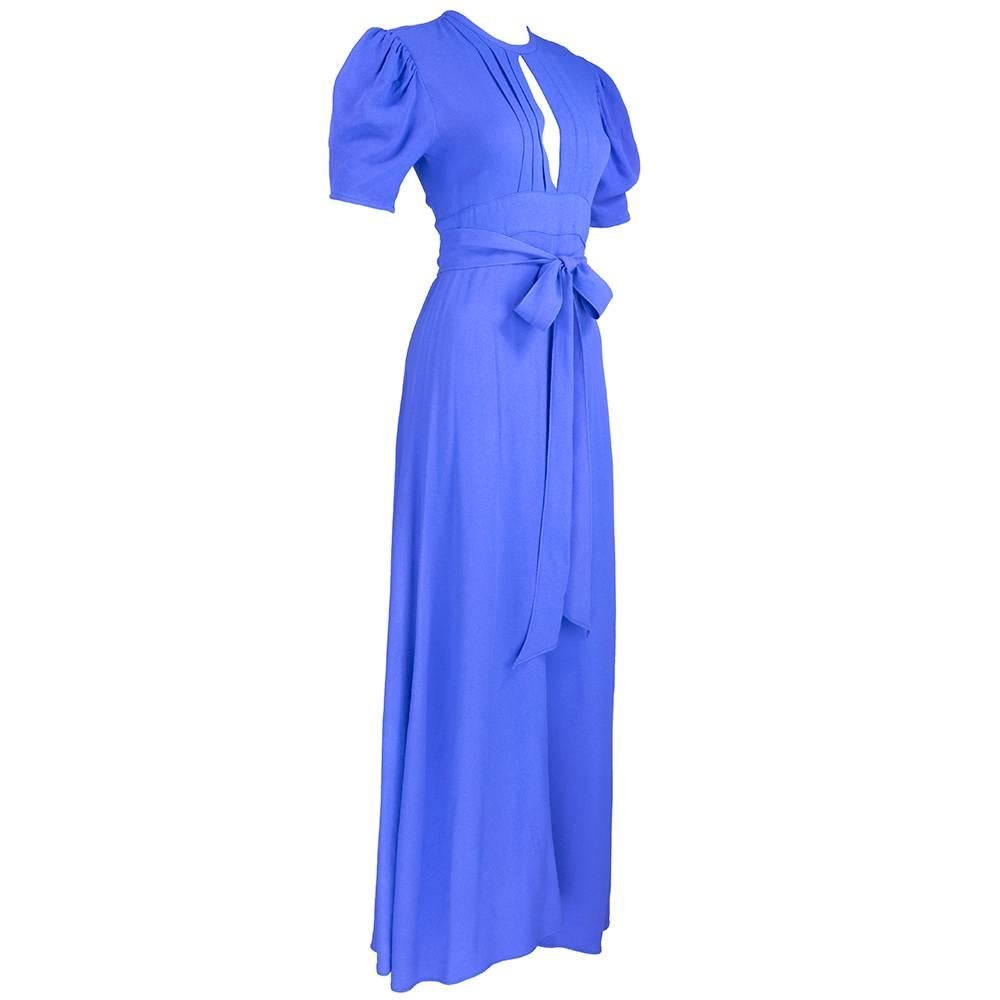 Great 40s styling on a moss crepe long dress by Ossie Clark. High waisted super sexy short sleeve wrap dress with vertical pleats with a center slit.  Bodice back has Wide opening and skinny self-tie at top.  Typical subtle gradient fade and patina