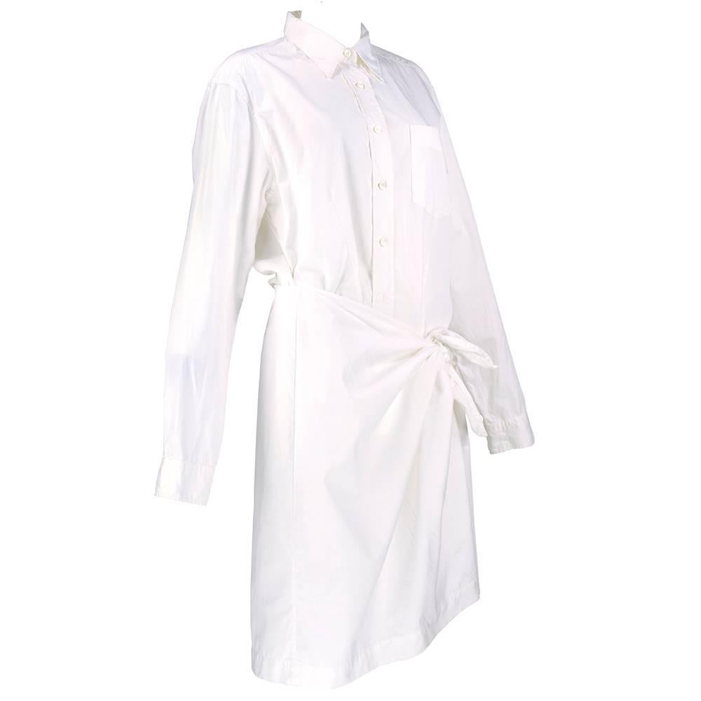 Classic crisp white button down shirt dress with wrap style skirt by Dries Van Noten. Timeless classic.