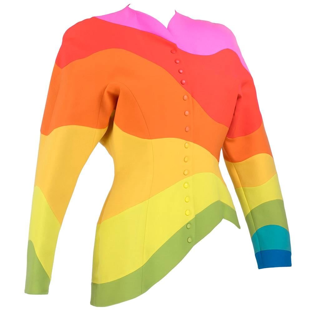 Iconic piece by Thierry Mugler. Undulating rainbow stripes on a fully lined jacket. Snap closure down font.  