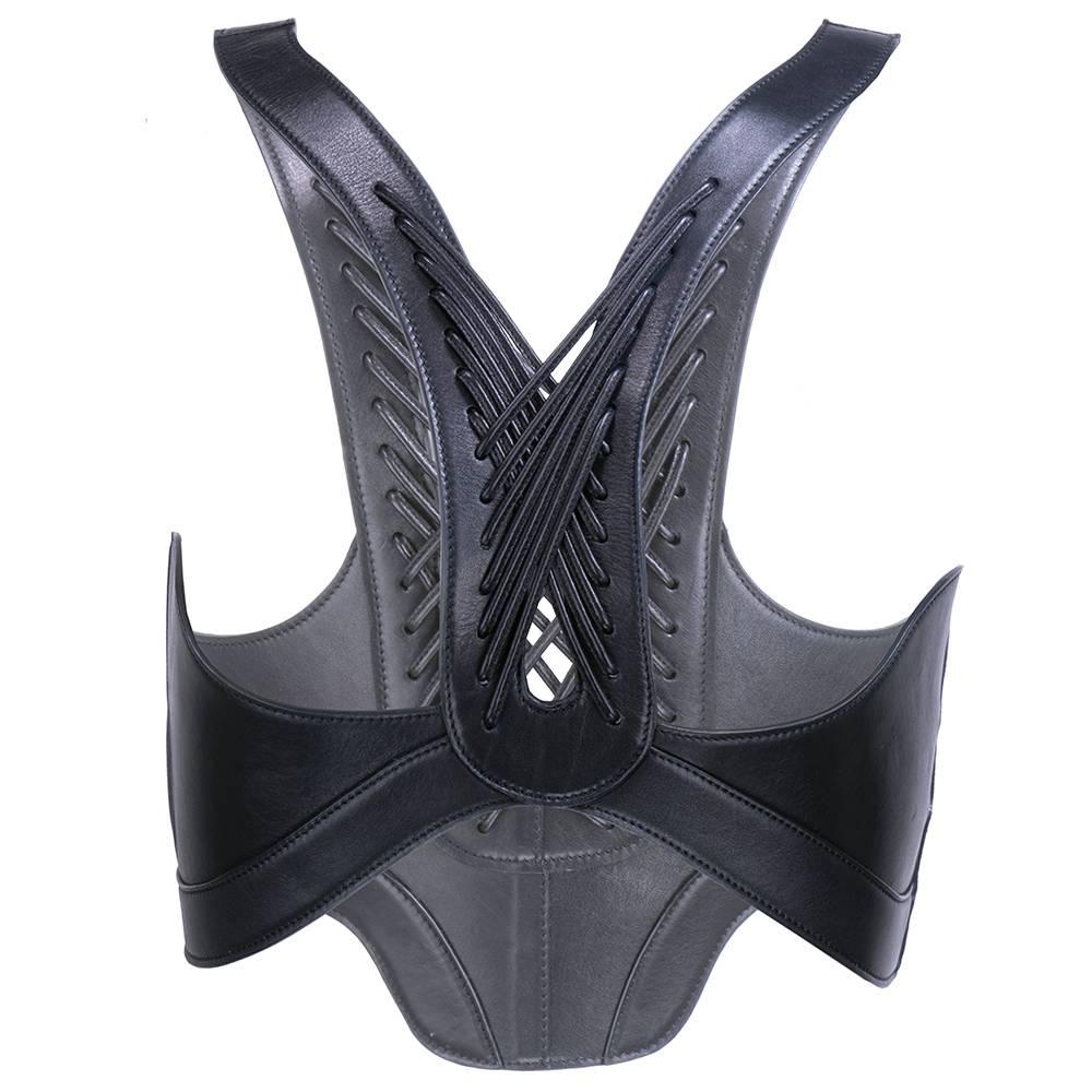 Highly dramatic, super structured black leather harness by Alexander McQueen. Contemporary piece. Side closure with hook and eyes.  32 inches the under bust.