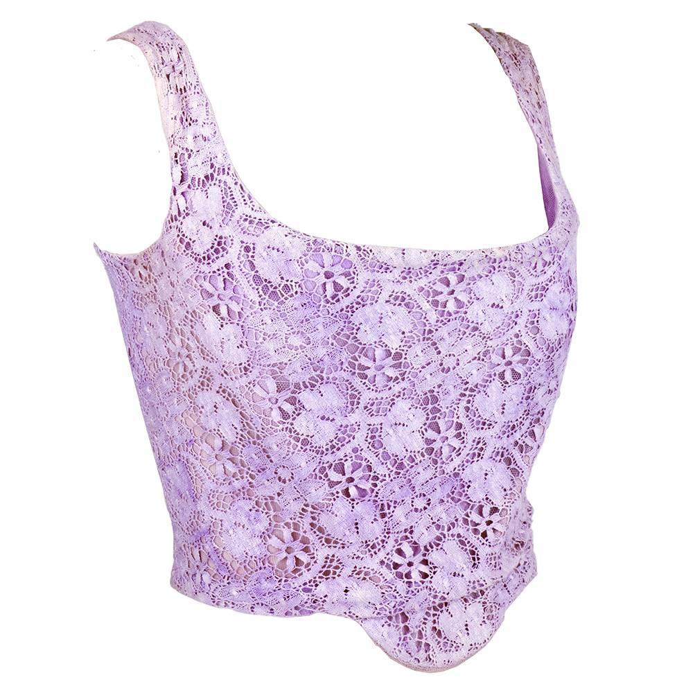 Circa 1990s classic corset style bustier by Vivienne Westwood. Lilac 100% cotton lace, fully boned and zips up back.