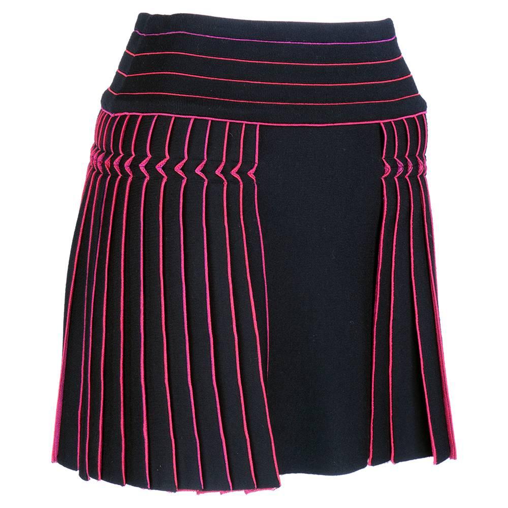 Sexy, super short pleated skirt in black and hot pink knit. Interesting pleating. Zips up back.