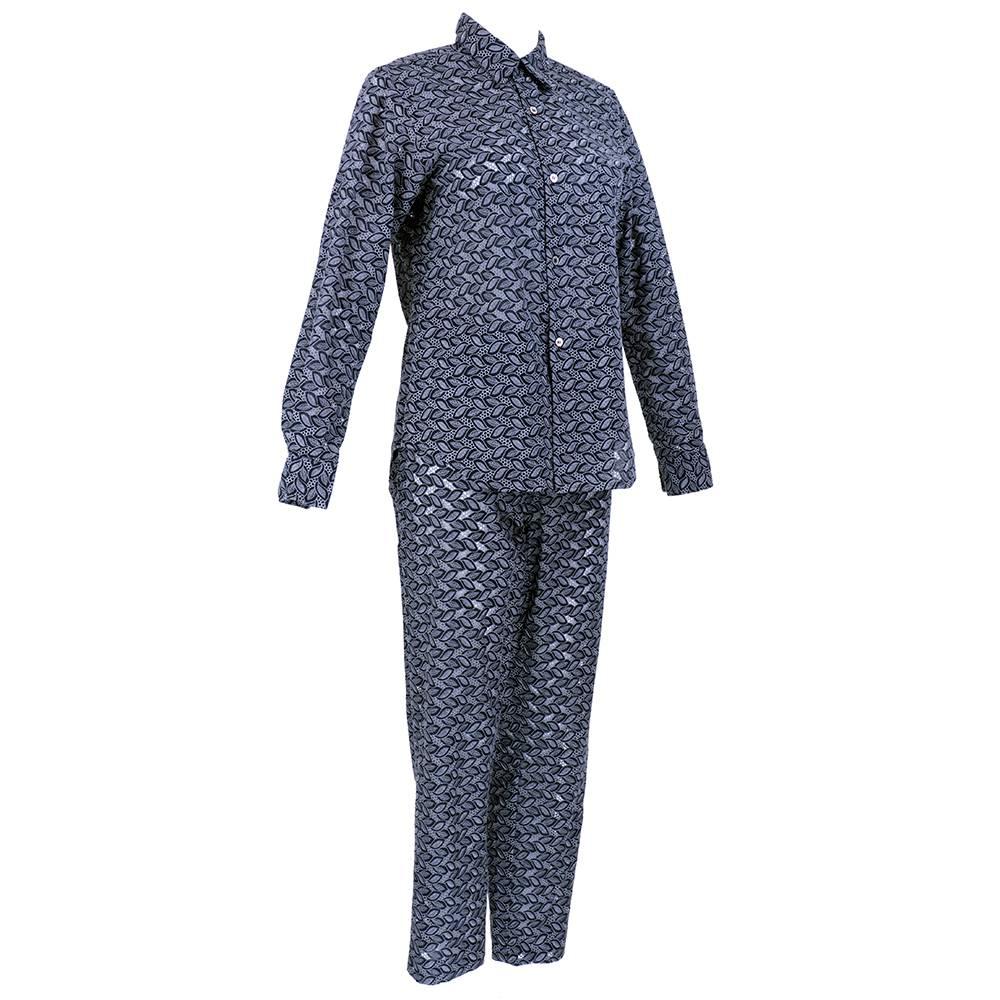 Two piece ensemble by Comme des Garçons of 100% cotton. Indigo cotton eyelet with grey embroidery. Unlined button down shirt with left patch pocket.  High waisted slim leg pant with side zip.  

Pants-
Waist: 30
Hip: 40
Inseam: 26.5