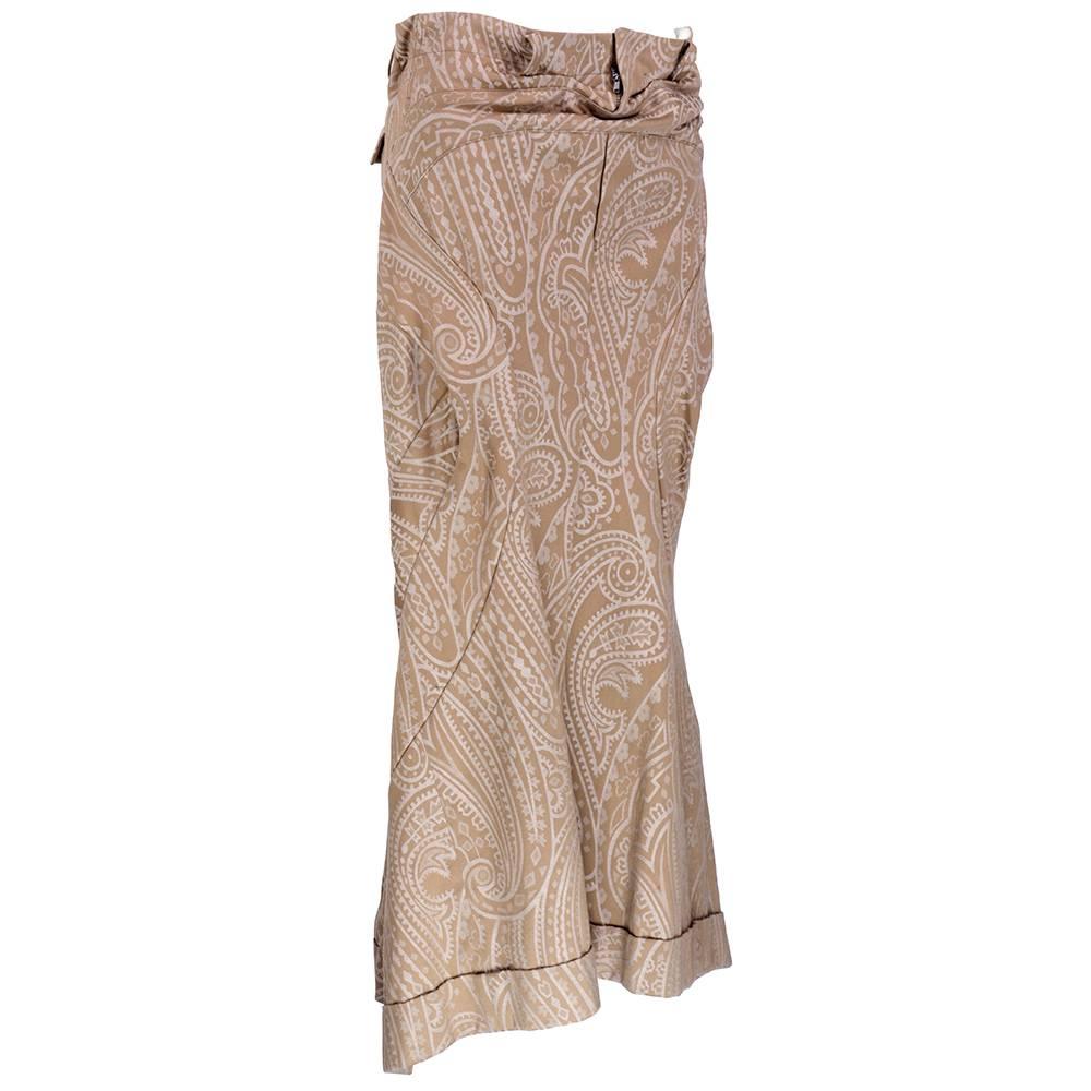 Interesting detailed full length skirt in taupe. Flute hem with cuff. Symmetrical arched and peaked seams throughout create avant garde silhuoette. Short to long hem. Genius construction!!