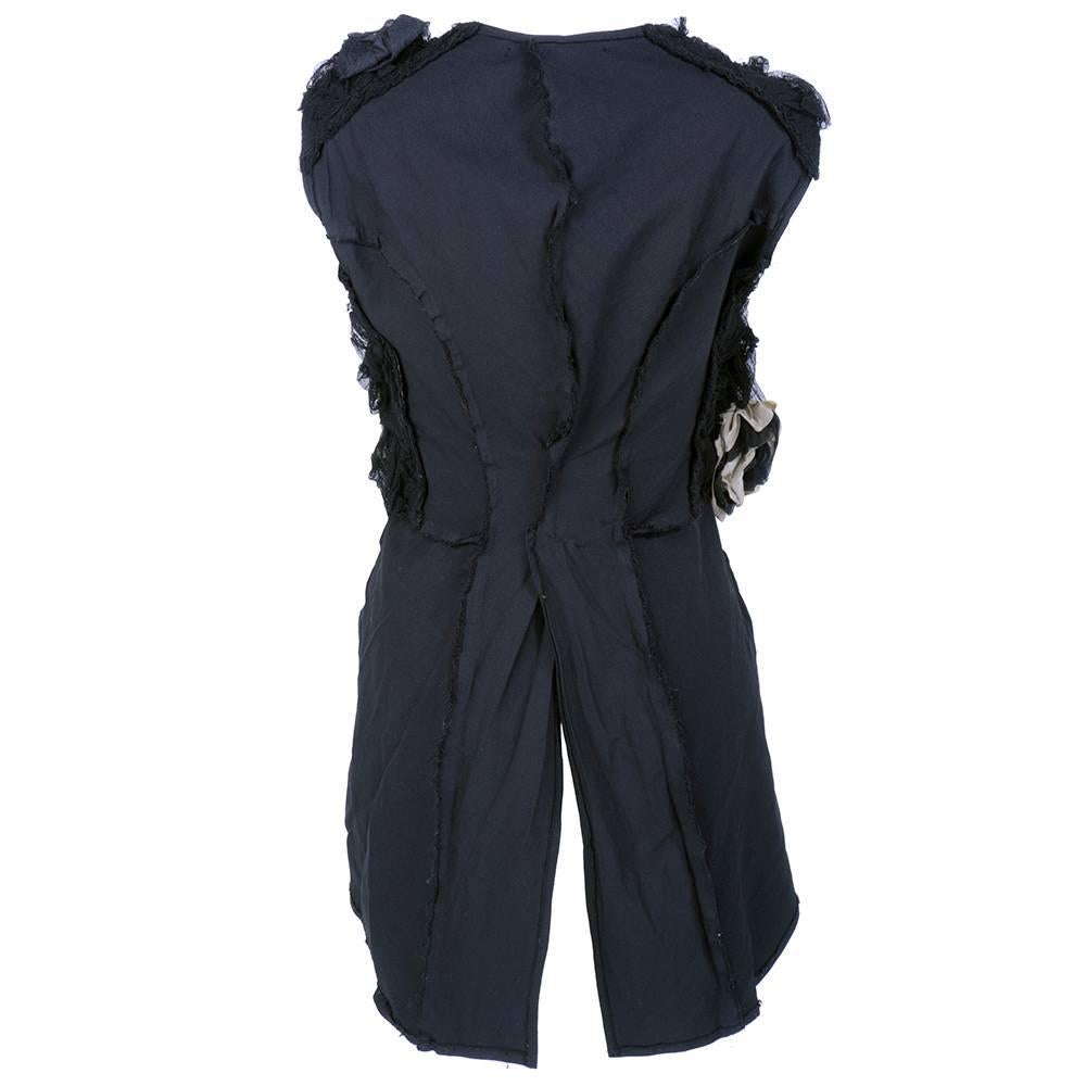 Comme des Garçons sleeveless cotton waistcoat by Rei Kawakubo. Raw edged stretch rayon with silk and tulle floral embellishment. Vented at rear.
