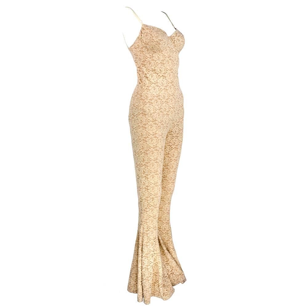 Beyond super sexy stretch catsuit. Nude lace  - fully lined with built in bra.  Fabulous flair on the legs.  Adjustable straps. Fashion for the brave.