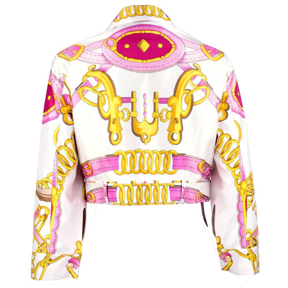 Wonderful, whimsical little silk cropped jacket by Dior Boutique. Equestrian themed in pink and gold tones with gold tone logo buckle.  Fully lined.  100% silk.