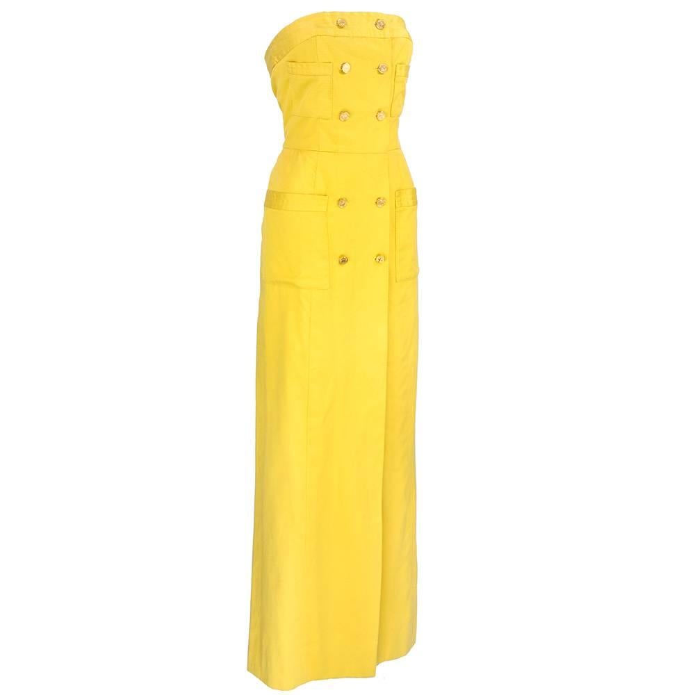Summer weight and style casual evening gown in 100% cotton by Chanel Boutique circa 1980s. Slight nautical feel in faux double breasted logo buttons down front. Semi lined - with inner petersham for proper fit. Partially lined and most importantly -
