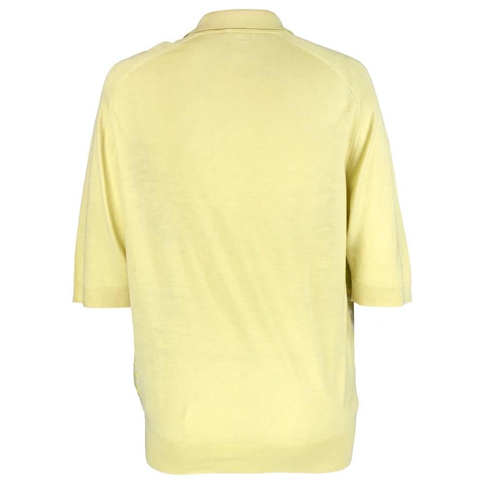 Classic, preppy styling with hermes silk scarf front knit top. Gold tone logo buttons. 

Chest: 42 inches
Length: 27 inches