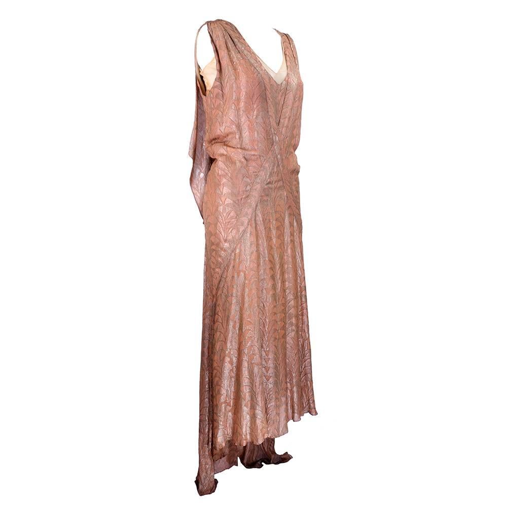 Stunning 1930s era gown in copper lame with "Bama" label. Deco style pattern with interesting bias cut. Unlined.