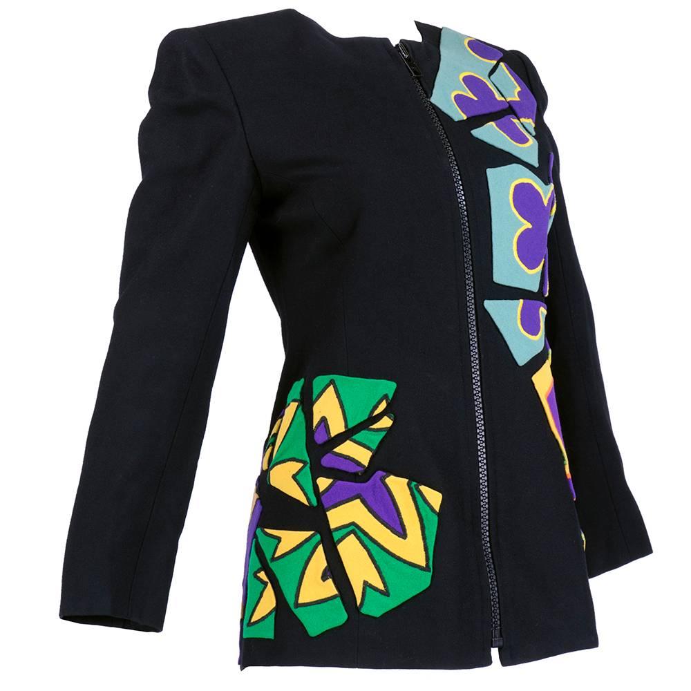 Quirky appliqued jacket by enigmatic designer Christian Francis Roth. Middle weight 100% wool with multi-colored patches in wool and velvet. Fully lined, shoulder pads, and zip front. Several tiny dings in fabric - not noticeable when worn but can