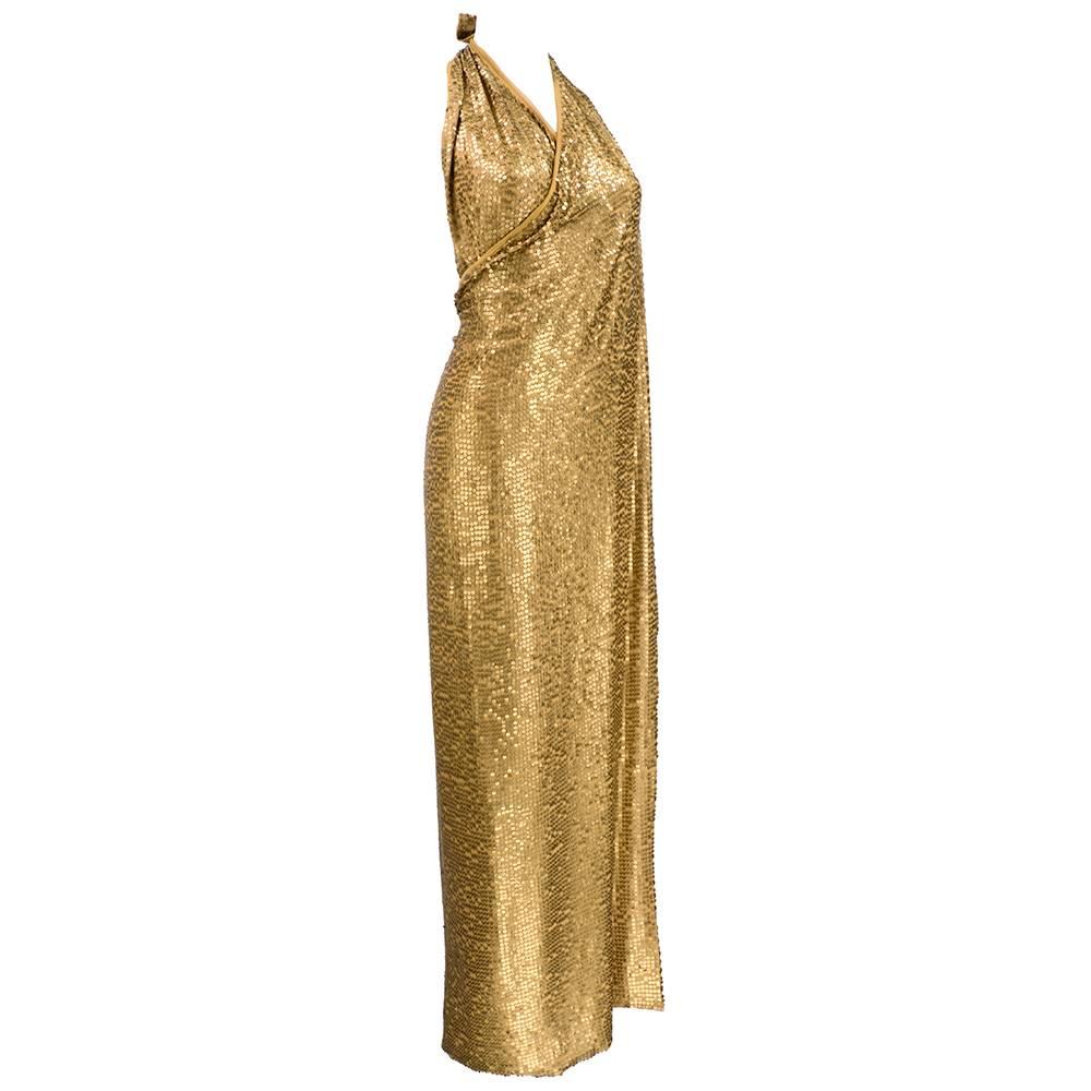 Goddess style wrap gown with golden sequins. Wraps at neck. Fully lined with beautiful drape. Sizing flexible due to style. Updated Hollywood glamour.
Length approximate 50 inches.