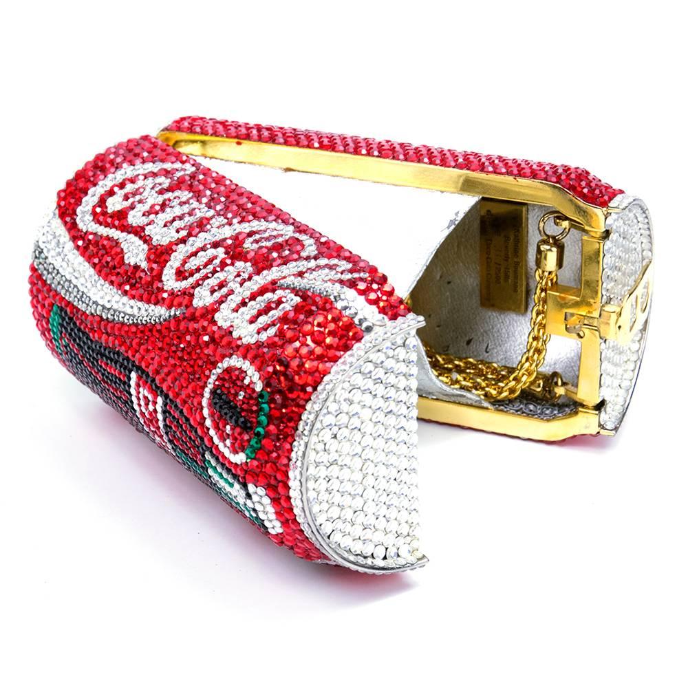 Whimsical evening bag by Katherine Baumann - numbered 36 out of 2500. Crystal encrusted Coca-Cola can. Hidden gold tone chain shoulder strap. Pull tab opening. Peeling in the interior.