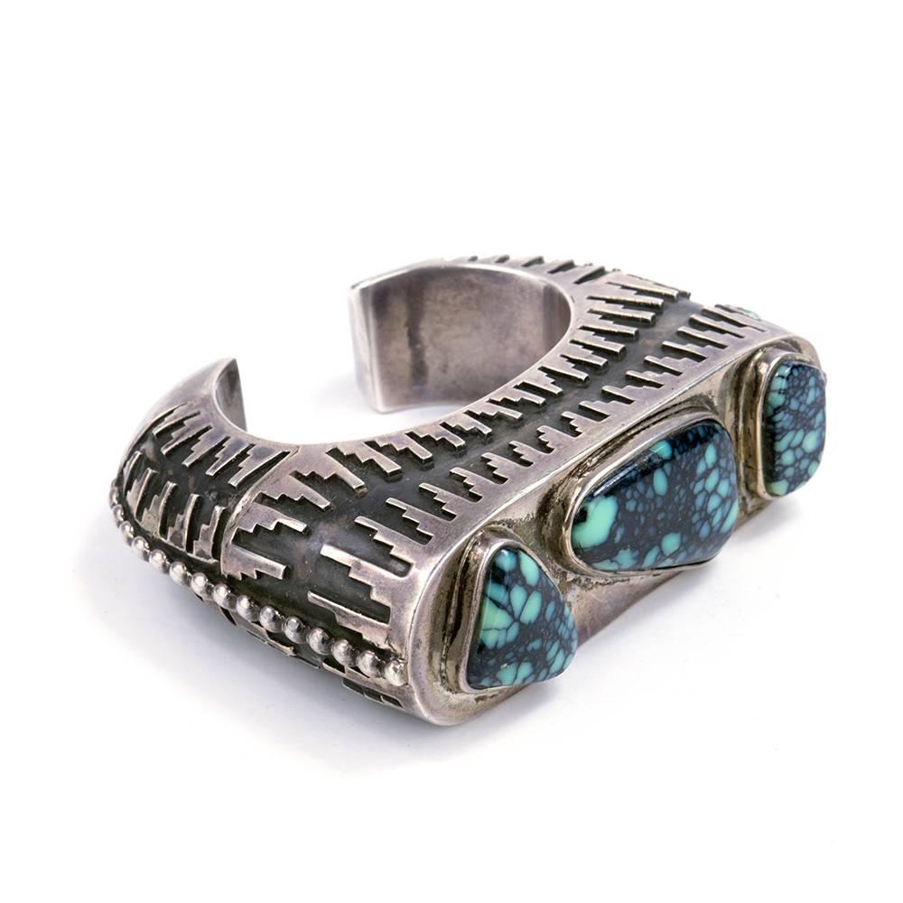 Created Navajo artist Hank Whitethorne - this hefty cuff is beautifully constructed with large highly polished turquoise stones.

Height at front: 1