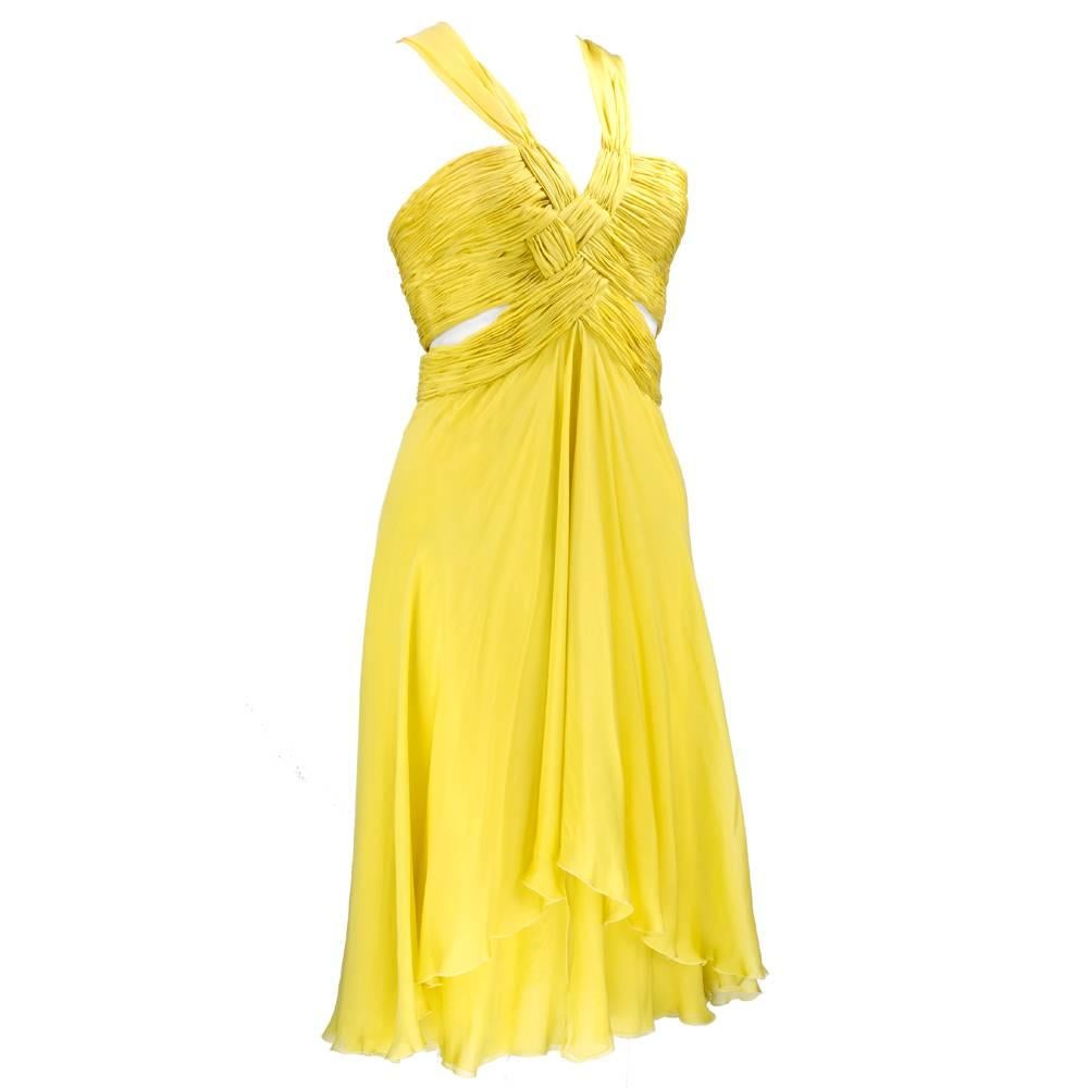 So sexy! Muted yellow layered chiffon party dress. Woven bodice of shirred fabric with cut out sides. Flared skirt. Great for dancing or the red carpet. Complicated design - easy wearing.